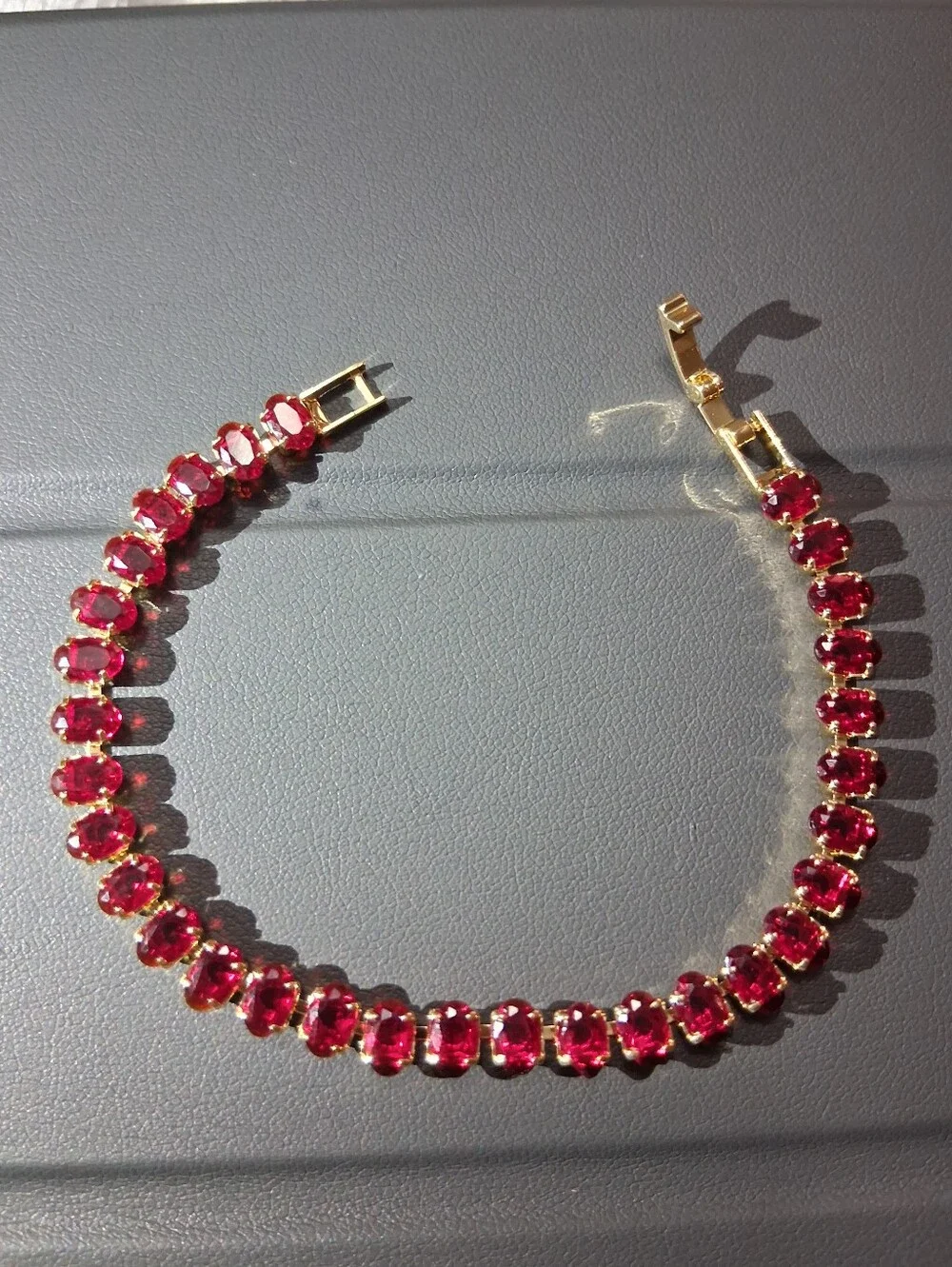 Gold Tennis Bracelet with Red Oval Stones